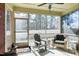 Relaxing screened porch with ceiling fan and views of the wooded backyard at 80 Thornwhistle Pl, Garner, NC 27529