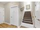 Stairway featuring carpet treads, white risers and a stained wood handrail at 80 Thornwhistle Pl, Garner, NC 27529