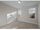 Bedroom filled with natural light from two windows, neutral walls and carpet enhance the room's open feel at 801 Pryor St # 48, Mebane, NC 27302