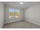Bedroom showcasing a window with natural light, neutral walls, and carpet for a cozy and inviting space at 801 Pryor St # 48, Mebane, NC 27302