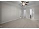 Spacious bedroom featuring plush carpet, ceiling fan, and convenient access to a walk-in closet and bathroom at 801 Pryor St # 48, Mebane, NC 27302