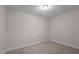 This bedroom features neutral walls, carpet, and a recessed light for a serene and comfortable living space at 801 Pryor St # 48, Mebane, NC 27302
