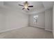 Comfortable bedroom with plush carpeting, tray ceiling, and a ceiling fan at 801 Pryor St # 48, Mebane, NC 27302
