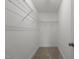 Walk-in closet features carpet flooring and wire shelving along the walls for optimal storage solutions at 801 Pryor St # 48, Mebane, NC 27302