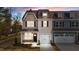 Charming townhome exterior with stone accents, a private garage, and a well-manicured lawn at 801 Pryor St # 48, Mebane, NC 27302