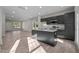 Modern kitchen with a granite island, stainless steel appliances, and an open layout to the dining area at 801 Pryor St # 48, Mebane, NC 27302