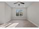 Bright, open room with a ceiling fan and a large window offering plenty of natural light at 801 Pryor St # 48, Mebane, NC 27302