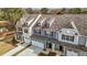 Aerial view of modern townhomes, showcasing rooflines, driveways, and landscaping at 803 Pryor St # 47, Mebane, NC 27302