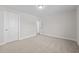 Bedroom with large window, ceiling light, and open doorway at 803 Pryor St # 47, Mebane, NC 27302
