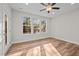 Bright bedroom with a ceiling fan, wood floors, large windows providing ample natural light at 803 Pryor St # 47, Mebane, NC 27302