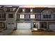 Charming townhome with a two-car garage, black shutters, and a welcoming front entrance at 803 Pryor St # 47, Mebane, NC 27302