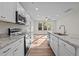 Modern kitchen featuring granite counters, stainless appliances and hardwood style floors at 803 Pryor St # 47, Mebane, NC 27302