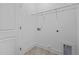 Functional laundry room with tile flooring, wire shelving, and hookups for a washer and dryer at 803 Pryor St # 47, Mebane, NC 27302