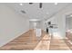Spacious living room with hardwood floors leading to an open concept kitchen and dining area at 803 Pryor St # 47, Mebane, NC 27302