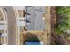 Aerial view of a modern townhome with a well-manicured yard and paved driveway at 807 Pryor St # 45, Mebane, NC 27302