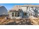 Townhome backyard featuring siding, windows, and small concrete patio at 807 Pryor St # 45, Mebane, NC 27302