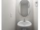 Elegant powder room with pedestal sink, mirror and hardware at 807 Pryor St # 45, Mebane, NC 27302