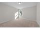 Cozy carpeted bedroom with neutral paint and a large window for natural light at 807 Pryor St # 45, Mebane, NC 27302
