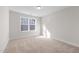 Carpeted bedroom with neutral paint and a large window for natural light at 807 Pryor St # 45, Mebane, NC 27302