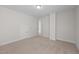 Large carpeted bedroom with neutral paint and two access doors is ready for your personal touch at 807 Pryor St # 45, Mebane, NC 27302