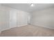 Carpeted bedroom with neutral paint and access doors is ready for your personal touch at 807 Pryor St # 45, Mebane, NC 27302