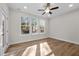Cozy bedroom with hardwood flooring, neutral walls, and lots of natural light at 807 Pryor St # 45, Mebane, NC 27302