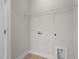 Large, bright laundry room with tile floor, utility connections, and shelving at 807 Pryor St # 45, Mebane, NC 27302