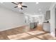Light-filled living area with hardwood floors, modern finishes, and open layout leading to kitchen at 807 Pryor St # 45, Mebane, NC 27302