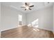 Serene main bedroom features hardwood flooring, a ceiling fan, tray ceiling, and an ensuite bathroom at 807 Pryor St # 45, Mebane, NC 27302