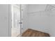 Walk-in closet features wood floor and wire shelving; the bathroom with glass door shower is located just outside at 807 Pryor St # 45, Mebane, NC 27302