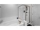 Clean, white bathroom featuring a soaking tub and glass-enclosed shower, offering a relaxing space at 814 Silo Park Dr, Wake Forest, NC 27587