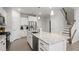 Gourmet kitchen featuring white cabinets, stainless steel appliances, and granite countertops at 814 Silo Park Dr, Wake Forest, NC 27587