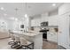 Open-concept kitchen with a large island, modern appliances, and seating for casual dining at 814 Silo Park Dr, Wake Forest, NC 27587