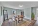 Comfortable dining area with hardwood floors, a wooden table, and decor at 9321 Stephenson Adams Ln, Willow Springs, NC 27592