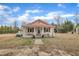 Charming single-story home with a red roof and a cozy front porch at 9321 Stephenson Adams Ln, Willow Springs, NC 27592