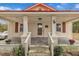 Charming front porch with rustic details and inviting entrance to a cozy, single-Gathering home at 9321 Stephenson Adams Ln, Willow Springs, NC 27592