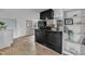 Kitchen area featuring bar with an adjacent bookcase and ample natural light at 9321 Stephenson Adams Ln, Willow Springs, NC 27592