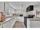 This kitchen features sleek countertops, modern appliances, and ample cabinet space at 9321 Stephenson Adams Ln, Willow Springs, NC 27592