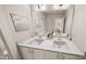 Bathroom featuring double vanity with white cabinets, modern mirrors, and contemporary fixtures at 934 Allen Park Dr, Knightdale, NC 27604