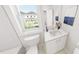 Bright bathroom featuring a white vanity and a window with a view at 934 Allen Park Dr, Knightdale, NC 27604