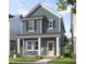 Charming two-story home features a covered front porch, beautiful landscaping, and a welcoming entryway at 934 Allen Park Dr, Knightdale, NC 27604