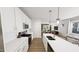 Modern kitchen featuring white countertops, cabinets, stainless steel appliances, and open to the living area at 934 Allen Park Dr, Knightdale, NC 27604