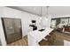 Modern kitchen with stainless steel appliances, a center island with seating, and pendant lighting at 934 Allen Park Dr, Knightdale, NC 27604