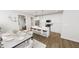 Bright kitchen with an island, barstool seating, stainless appliances, and a modern dining area at 934 Allen Park Dr, Knightdale, NC 27604