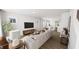 Open living room with stylish furniture, light hardwood floors, and lots of natural light at 934 Allen Park Dr, Knightdale, NC 27604