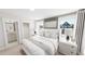 Serene bedroom with a large bed, windows, and an ensuite bathroom at 934 Allen Park Dr, Knightdale, NC 27604