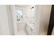 Bright bathroom with a double sink vanity and a large window at 936 Allen Park Dr, Raleigh, NC 27604