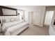 Bright primary bedroom with soft carpet, a closet, and neutral decor at 936 Allen Park Dr, Raleigh, NC 27604