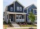 Charming two-story home featuring a welcoming front porch with beautiful landscaping and a modern color scheme at 936 Allen Park Dr, Raleigh, NC 27604