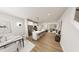 Open-concept kitchen featuring a large island and seating, stainless appliances, and light hardwood flooring at 936 Allen Park Dr, Raleigh, NC 27604